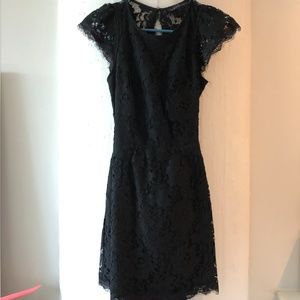 Short black floral lace dress with open back